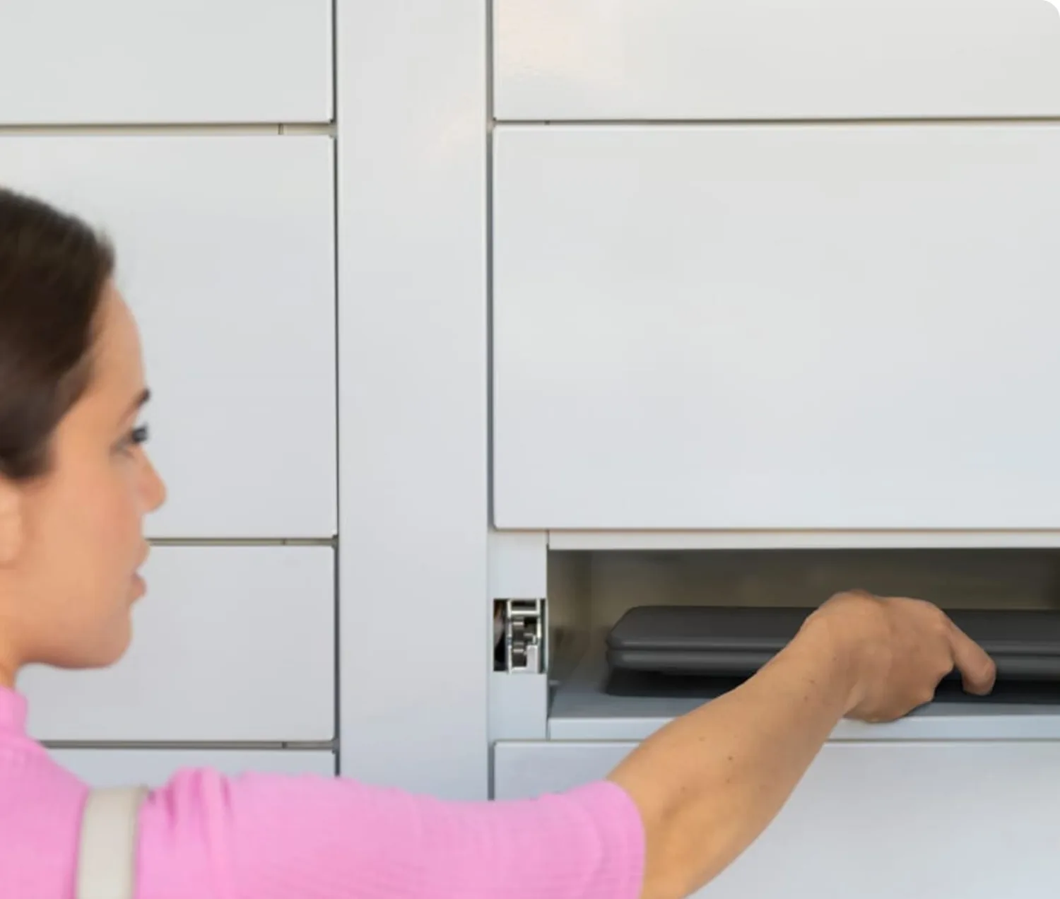 An employee collecting a laptop from an eLocker TechBar smart locker